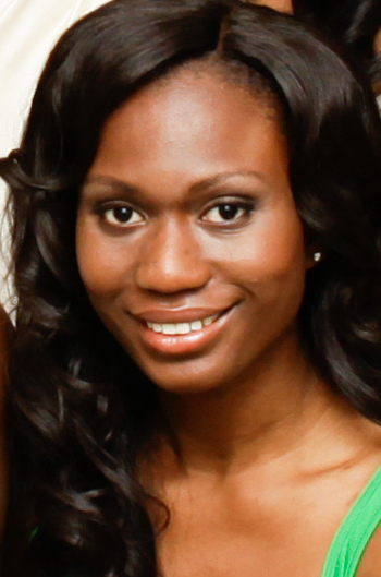 a woman's smiling face, with long hair